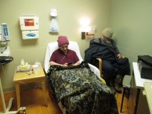 Room 2. I sit in the chair in front of EJ.