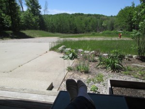 Waiting on the porch for EJ to return from the closing
