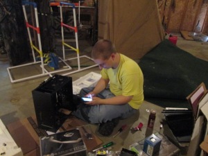 JJ building his computer in the garage.