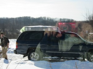 Our mattress on top of the Suburban--with my reflection in the window. 